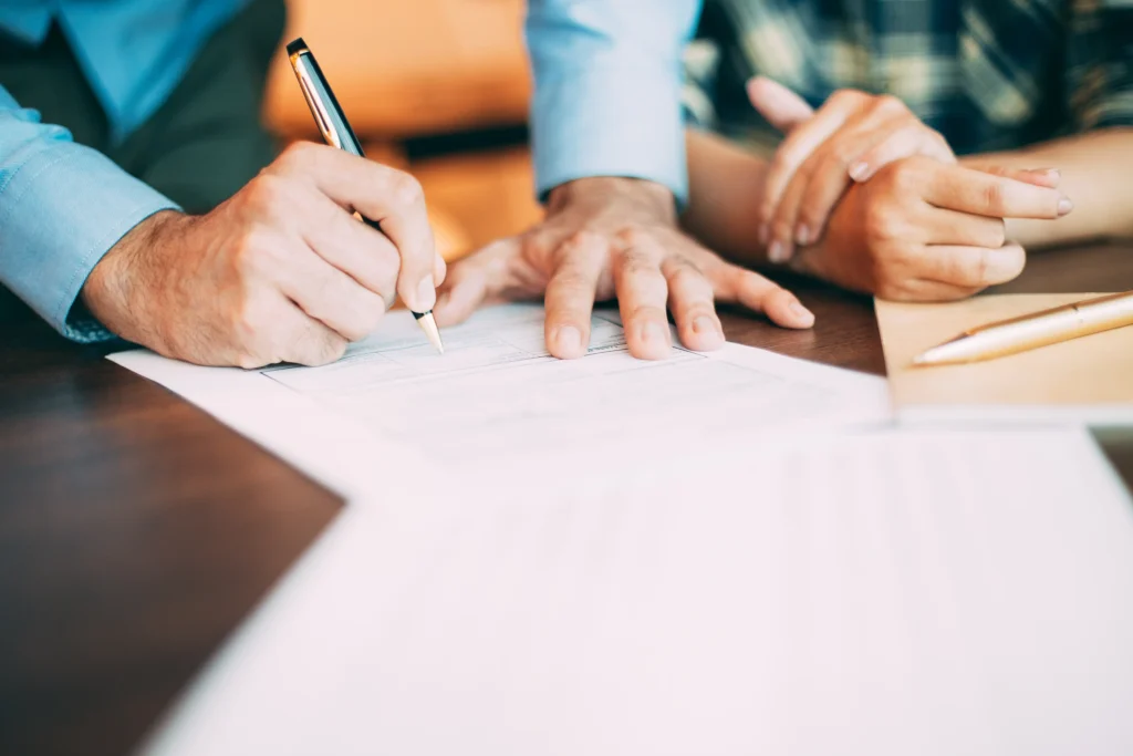 A modern family discussing future plans with a professional offering Will Writing Service East Sussex