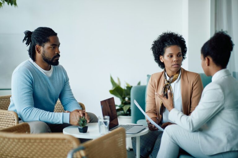 A confidential discussion between a client and a professional about Will Writing Services East Sussex in a private office setting
